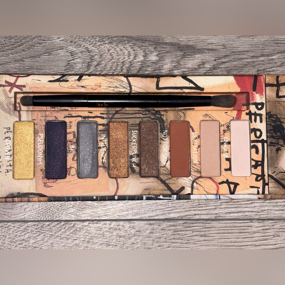 Urban Decay Eyeshadow Palette with Gold, Purple, and Brown Shades